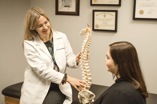Chiropractor Spring Grove IL Sonia Kwapisinski Talking With Patient Spine
